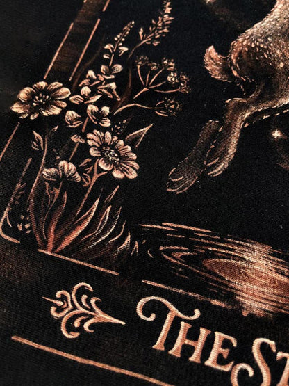 Hand-painted bleach art t-shirt of The Star tarot card, featuring a hare reaching toward a star