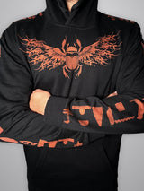 Front of the Anubis hoodie with a winged scarab bleach-painted across the chest and hieroglyphs on the sleeves, worn by a model