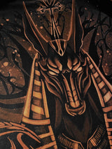 Close-up of the hand-painted Anubis head in copper bleach on black fabric