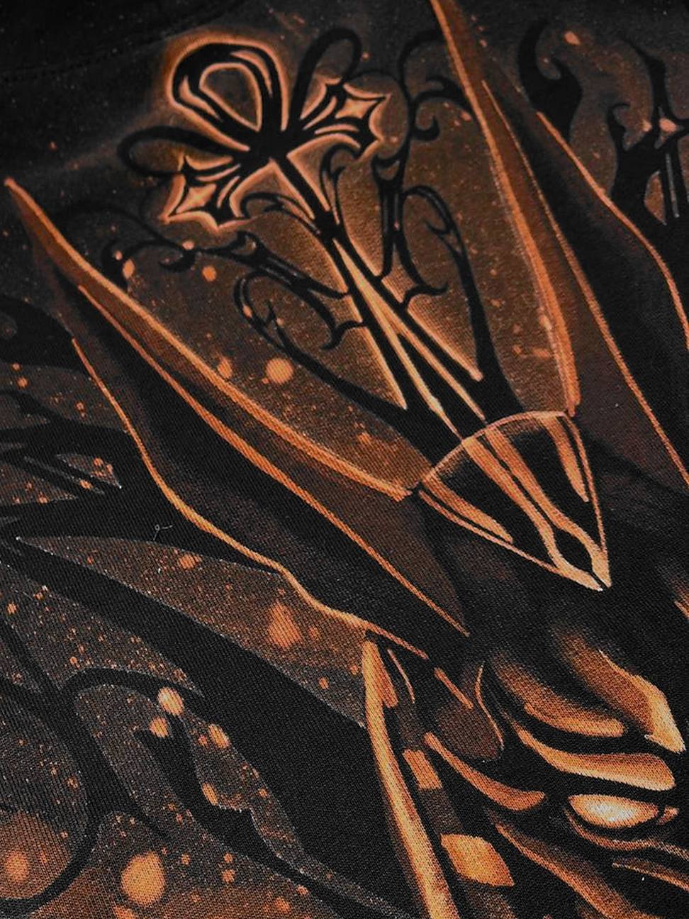 Close-up of the ankh and Anubis ears, hand-painted with bleach on black fabric
