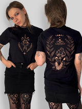 A model shown from the front and back wearing a black t-shirt with a bleach art mushroom graphic. The front features a smaller chest graphic, while the back features a large detailed graphic of a mushroom, a moth, and a moon phase wreath.