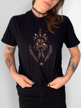 stencil bleach art t-shirt with a single mushroom design surrounded by leaves and a star, on black fabric
